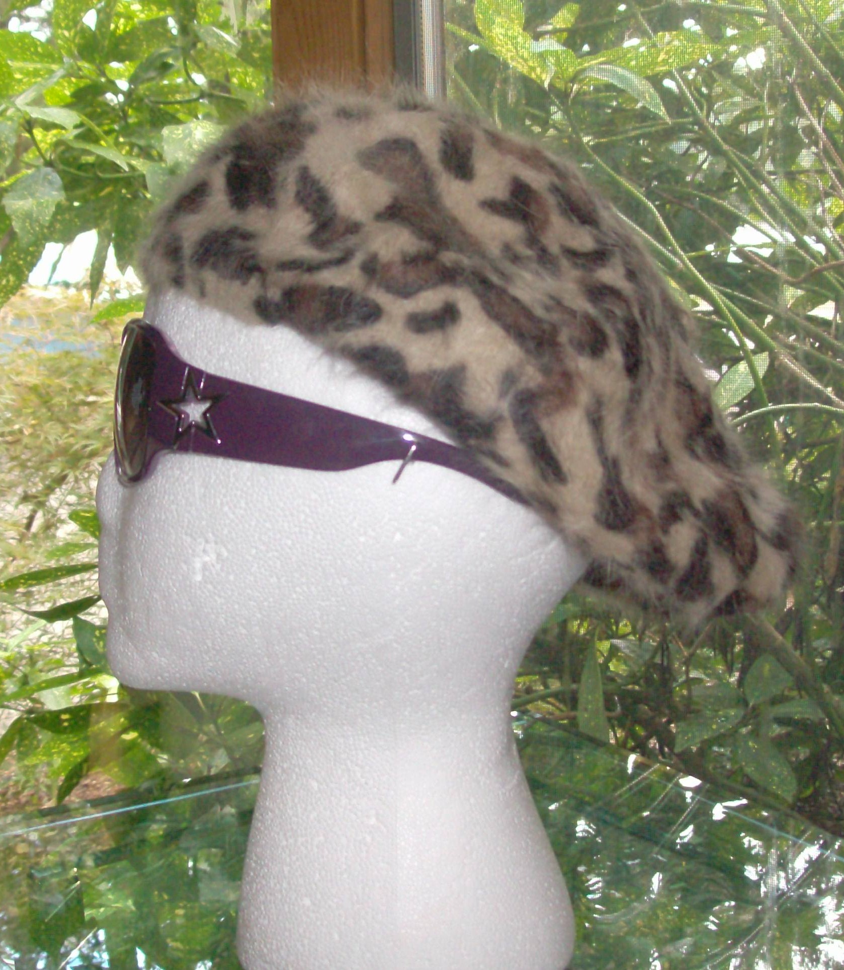 Leopard print beret beige background