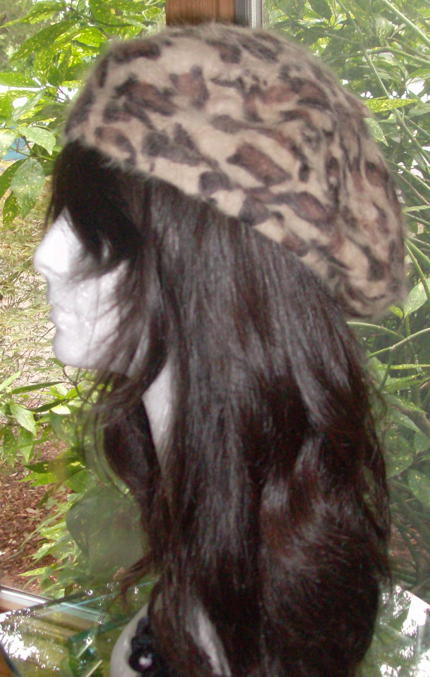 Leopard print beret beige background