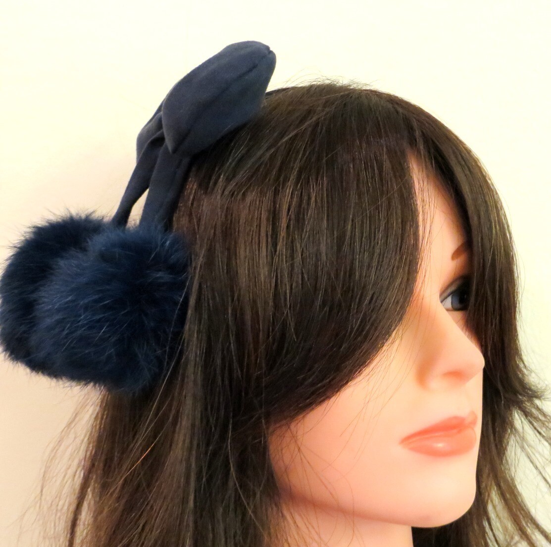 Blue bow headband with dangling pom poms