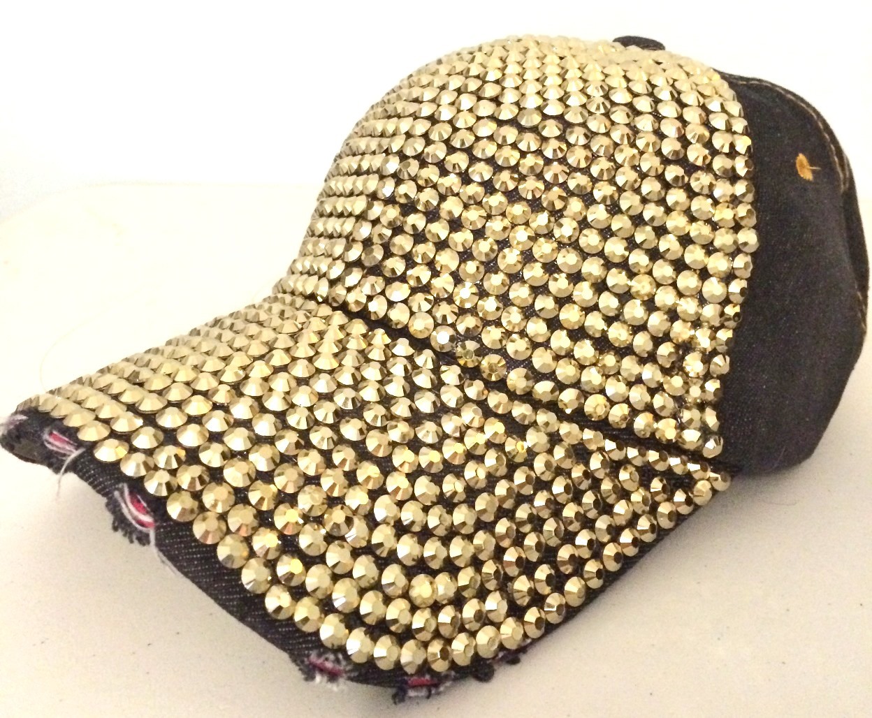 Black with gold bejeweled cap