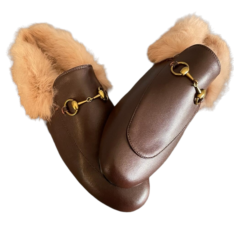 Brown leather slide mules with natural fur lining