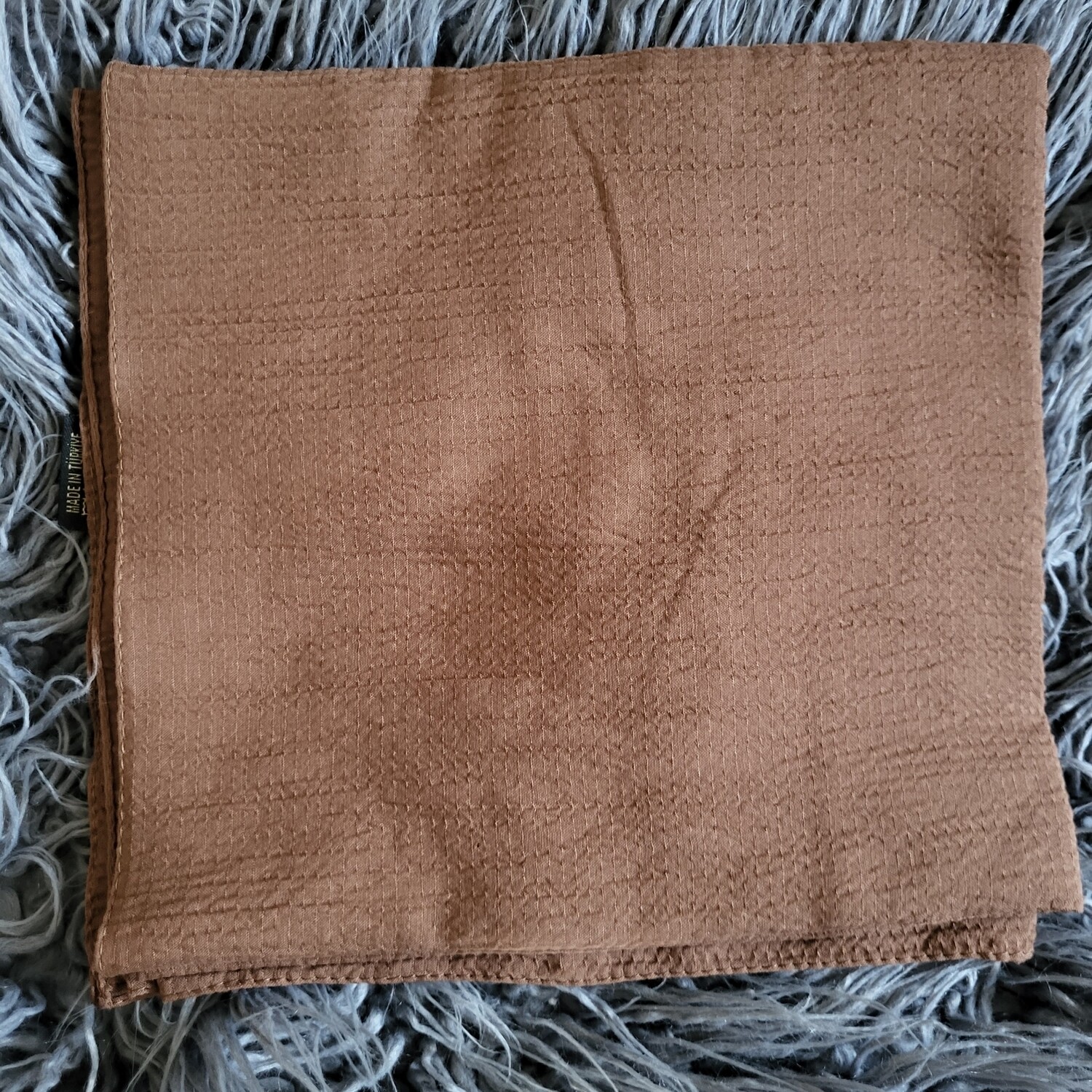 Brownish copper textured solid tichel