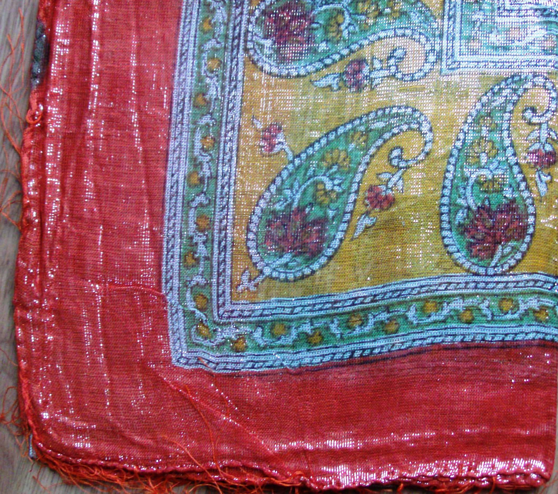 Orange shimmering tichel with yellow in center