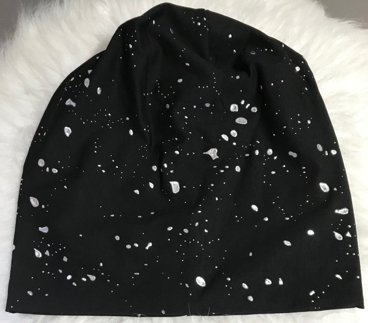 Silver paint splashed black beanie