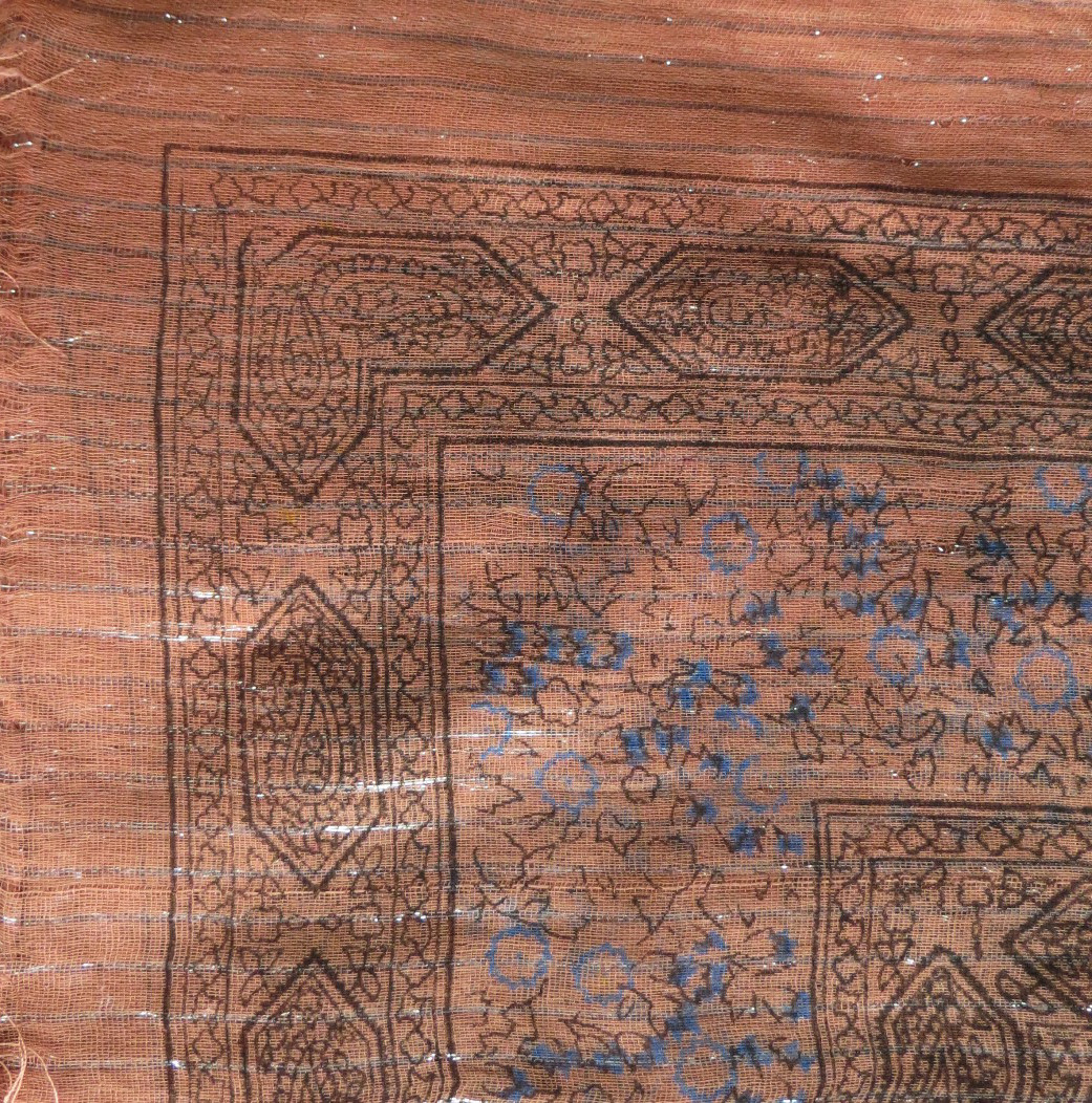 Burnt orange lurex tichel with blue berry flowers
