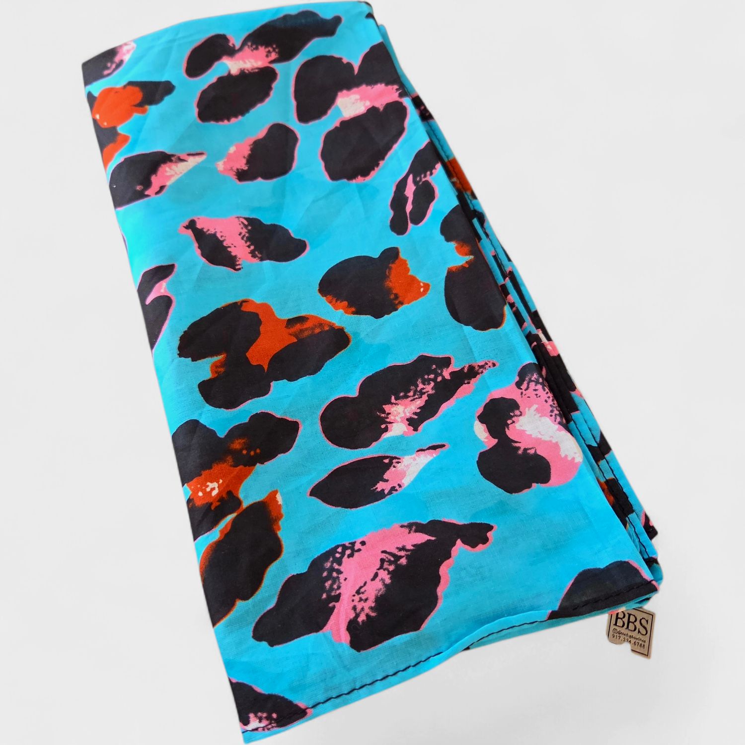 Turquoise animal patterned small square tichel.