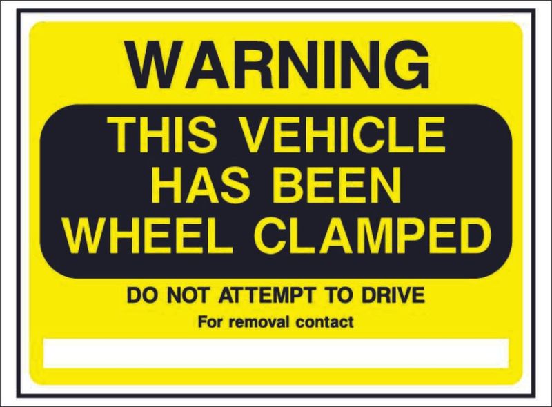 PARK0023--Warning-this-vehicle-has-been-wheel-clamped