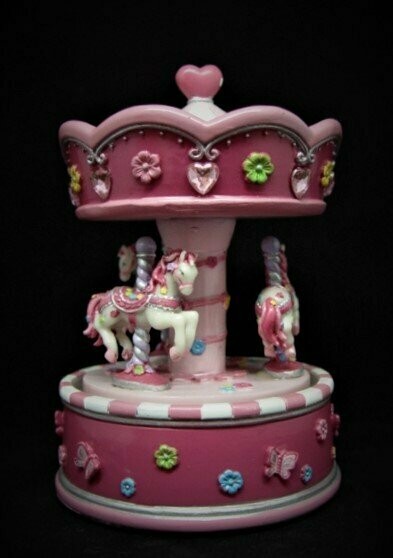 Carrusel musical con movimiento, rosa y fucsia