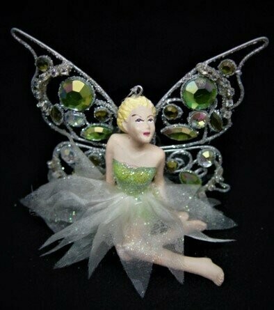 Figura de hada verde sentada