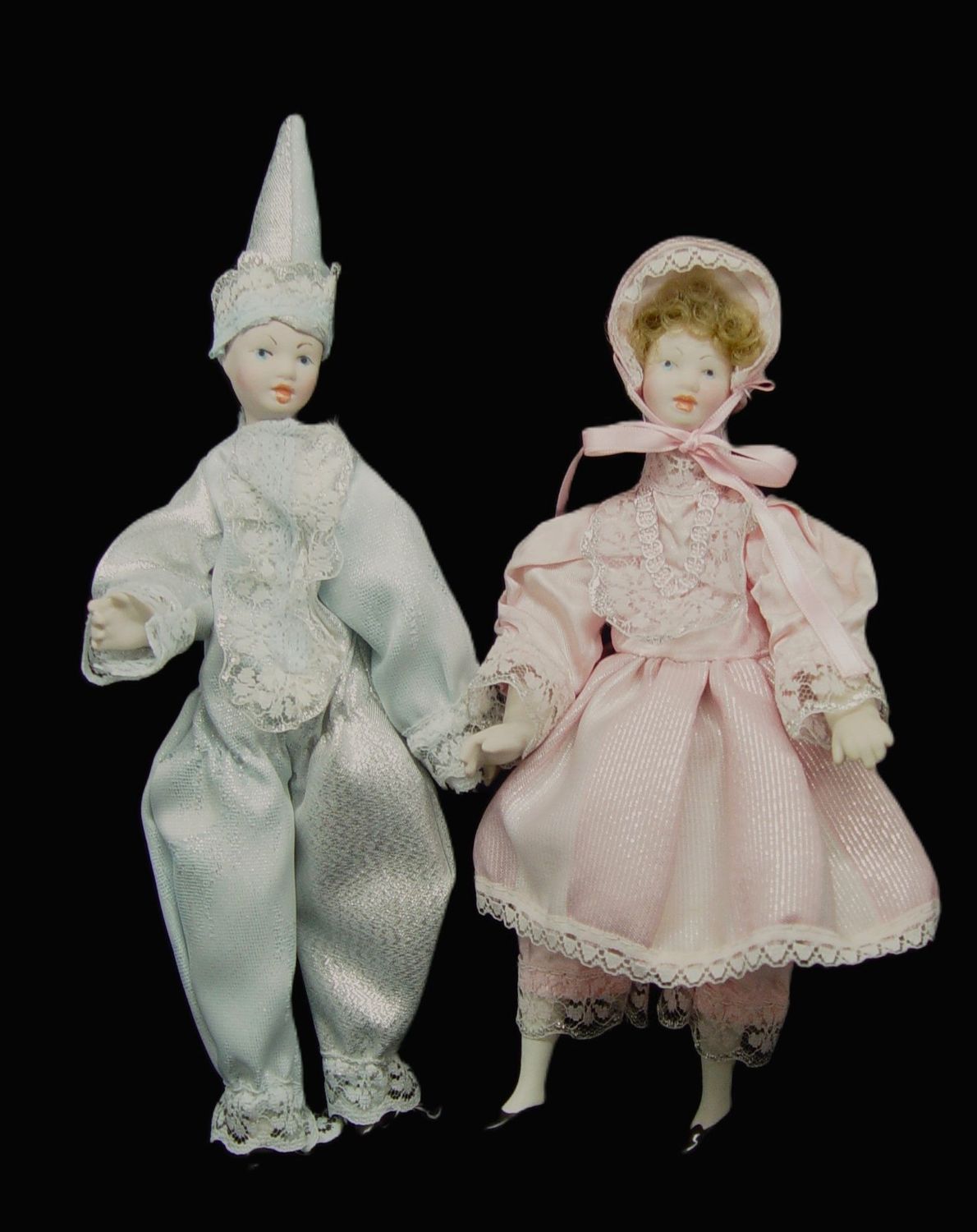 Pareja de muñecos de porcelana articulados