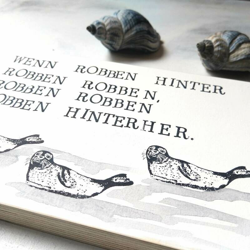 Schild Schild "Wenn Robben hinter Robben robben..."