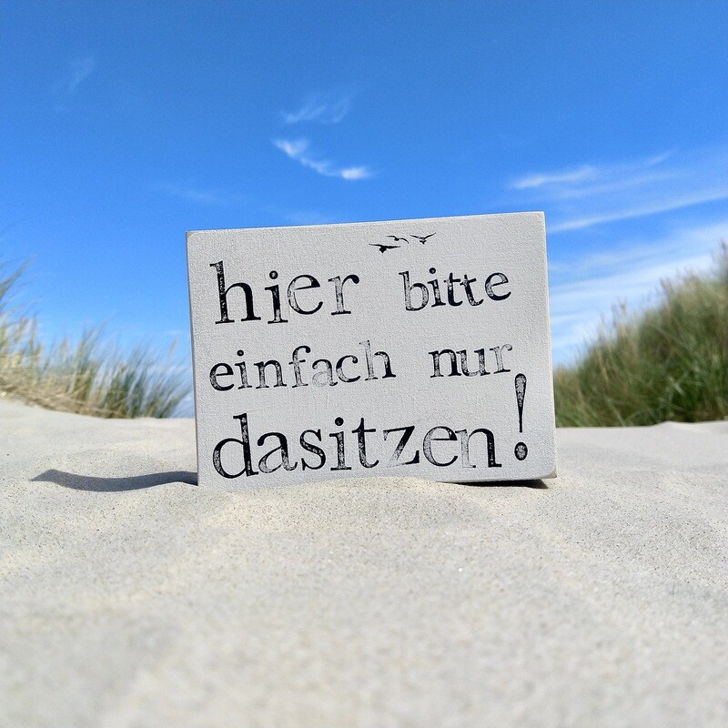 Schild Schild "Hier bitte einfach nur dasitzen"