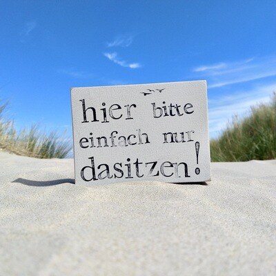 Schild Schild "Hier bitte einfach nur dasitzen"