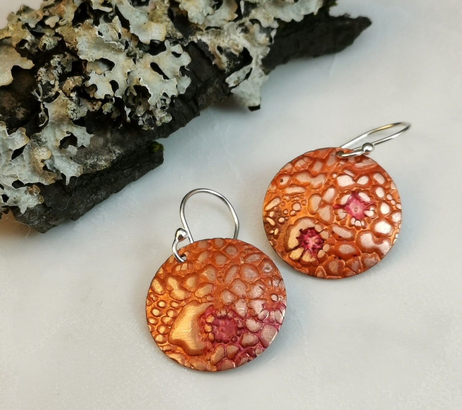 Round Flower Patterned Copper Earrings handpainted with hues of Tangerine Orange and Raspberry on Sterling Silver Ear Wires