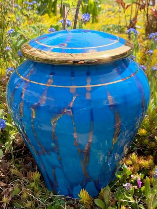 Ancient Creations ceramic cremation urn in turquoise with gold banding.