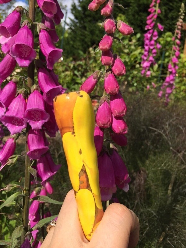 Ancient Creations Ceramics chillum in sun yellow with gold luster design, and real 22 karat gold.