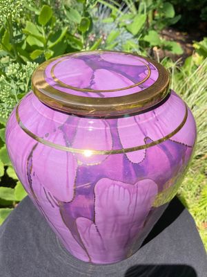 Ancient Creations ceramic cremation urn in purple with gold banding.
