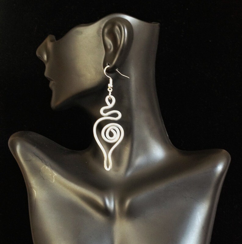 ​Ear Abstracts are intricately hand-crafted, beautiful, and deceivingly lightweight aluminum/brass/copper wire earrings that complement loc jewelry and natural hairstyles like Sisterlocks, locs, dreadlocks, braids, cornrows, and afros.
