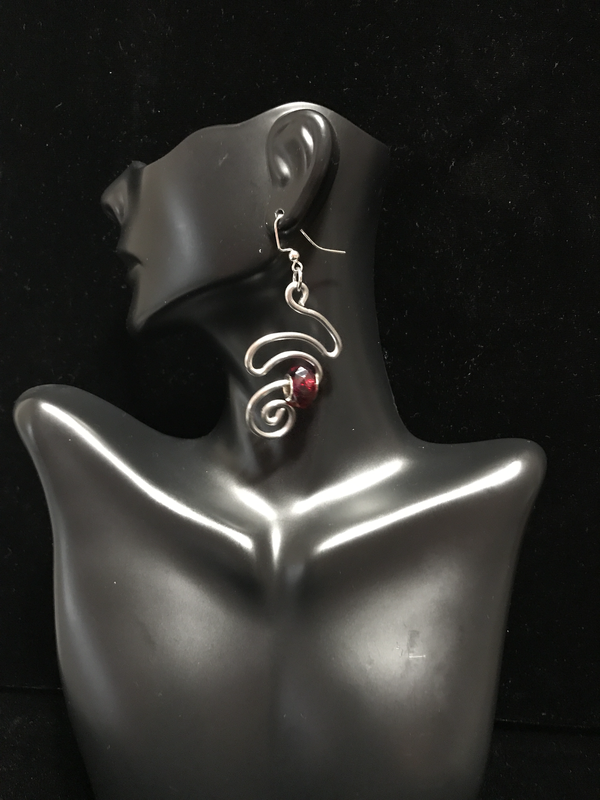 ​Ear Abstracts are intricately hand-crafted, beautiful, and deceivingly lightweight aluminum/brass/copper wire earrings that complement loc jewelry and natural hairstyles like Sisterlocks, locs, dreadlocks, braids, cornrows, and afros.