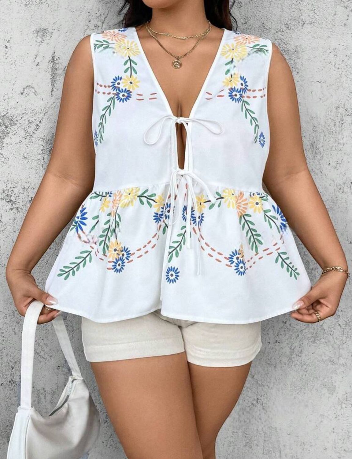 Blusa peplum de moños floral