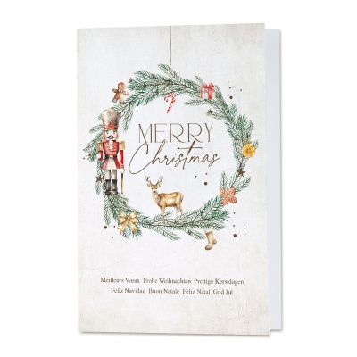 Traditionele zakelijke kerstkaart met kerstkrans en notenkraker
