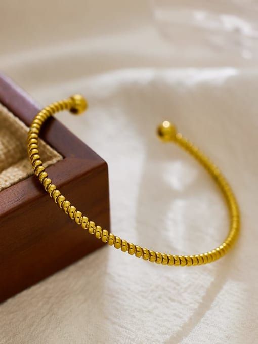 Golden twist cuff