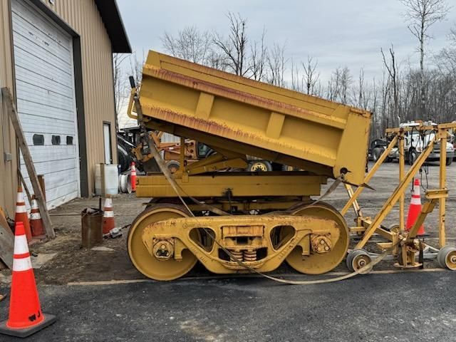 Rail based ballast dump cart