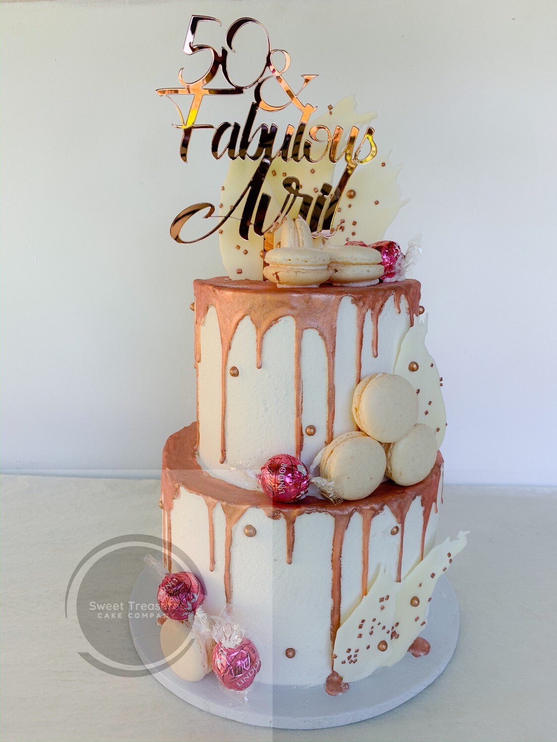White buttercream choc drip 2 tier cake
