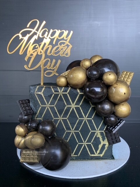 Square chocolate spheres topped Single tier cake