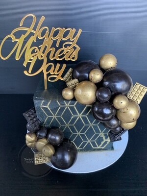 Square chocolate spheres topped Single tier cake