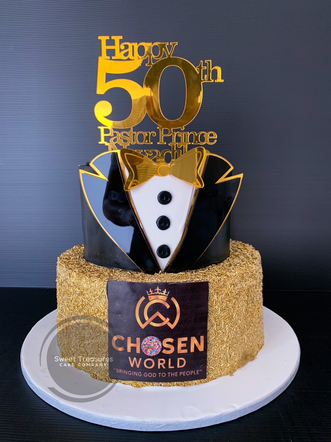 Black and gold suit 2 tier cake