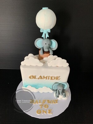 Hot air balloon and elephant half birthday Cake