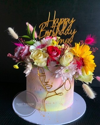Abstract Face with fresh flowers Single tier Cake