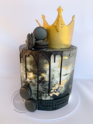 Single tier Black and white Marbled buttercream drip cake