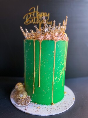 Crown topped gold drip single tier cake