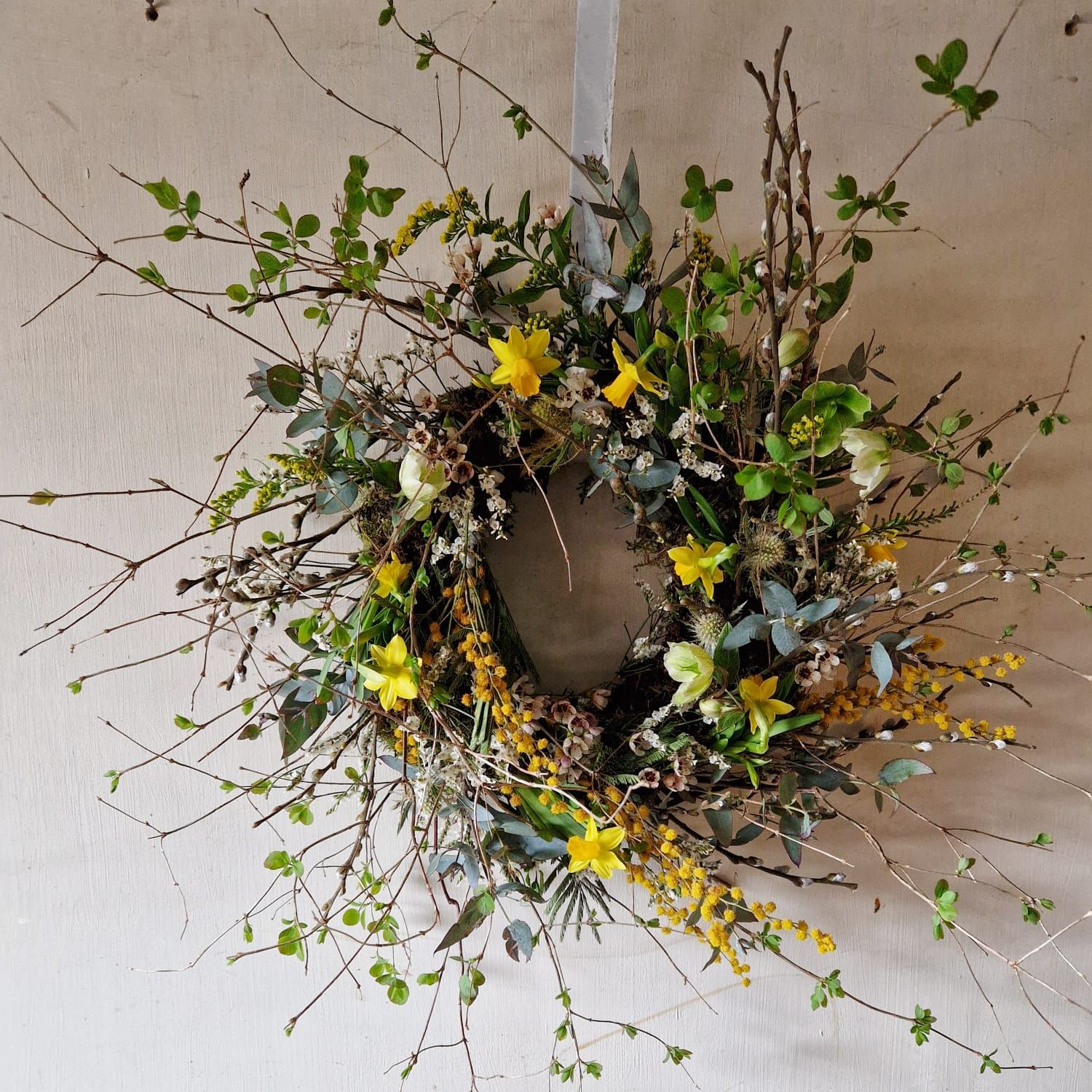 Rustic living spring wreath with daffodils and birch