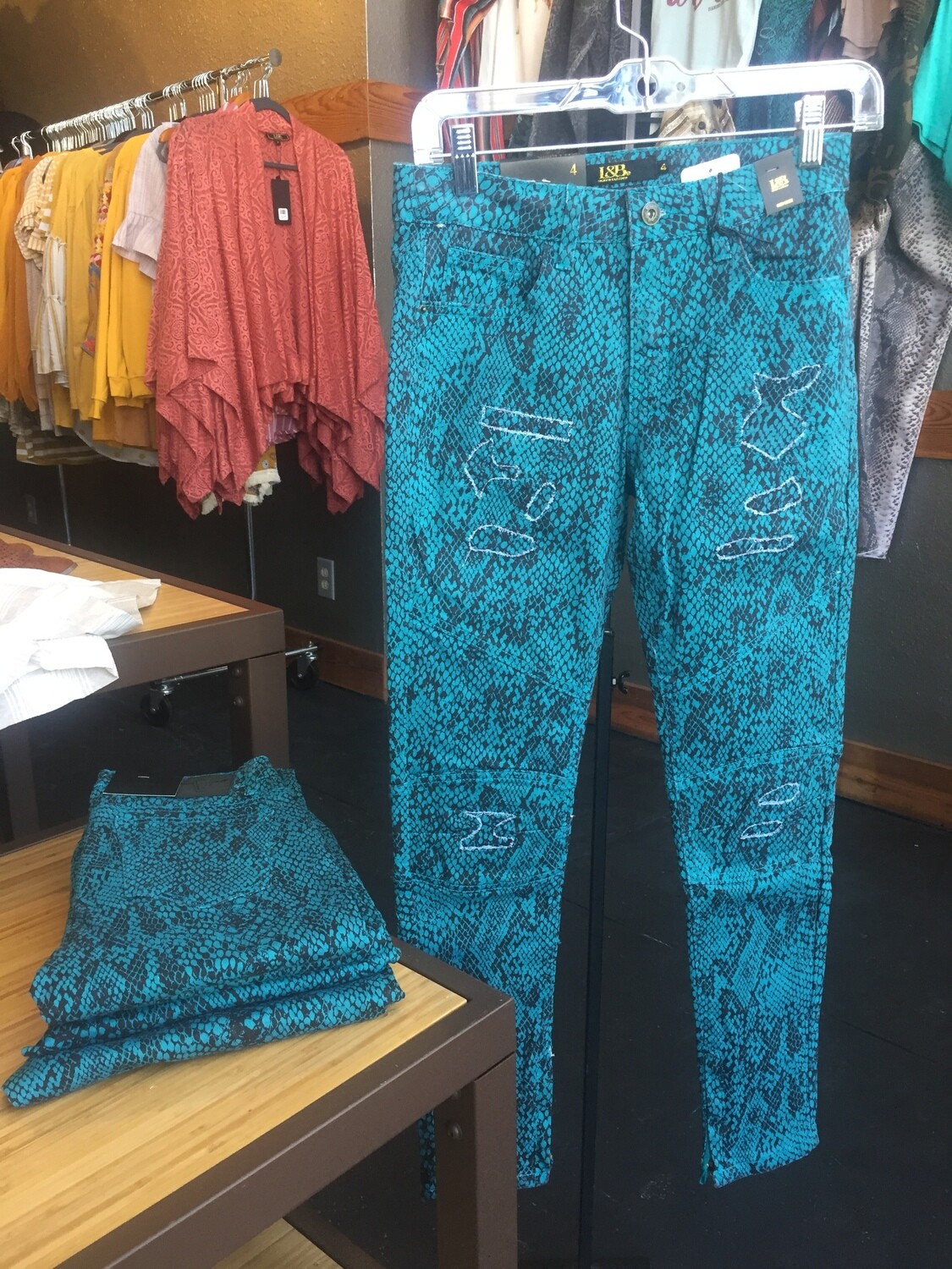 AAC - Teal colored snake print skinny moto jeans