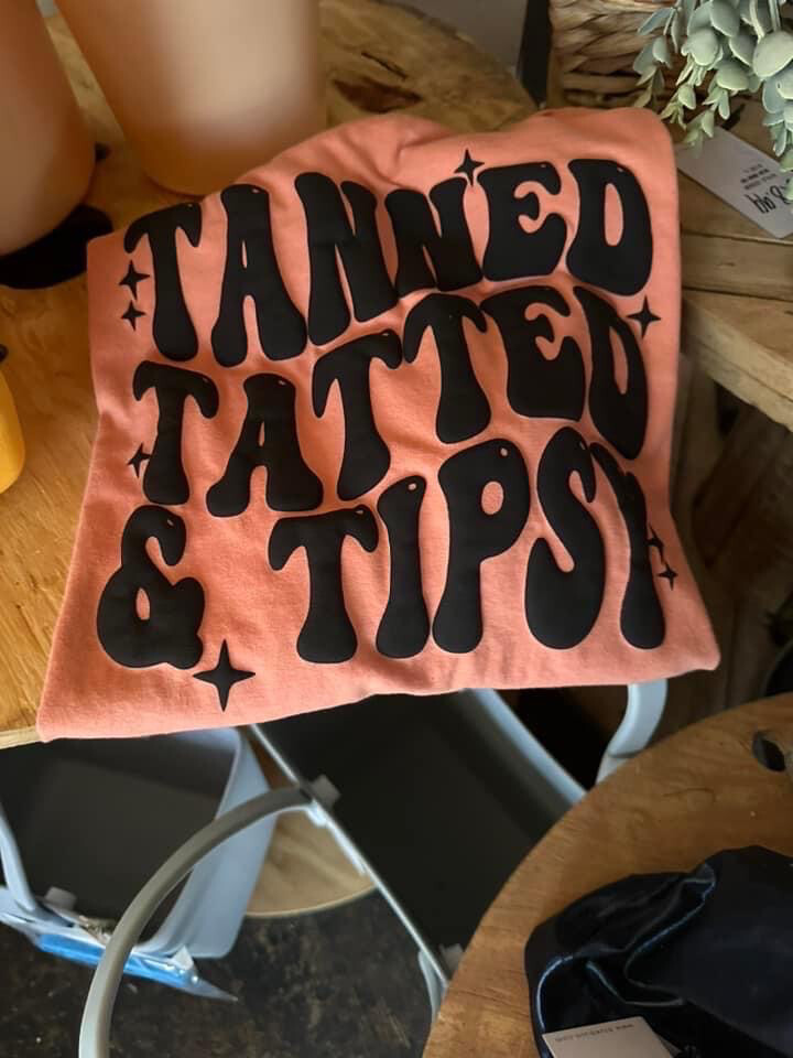 Tanned tatted and tipsy puff