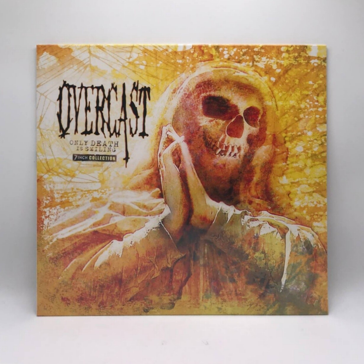OVERCAST -ONLY DEATH IS SMILING: 7 INCH COLLECTION- LP (YELLOW WITH BLACK SPLATTER VINYL)