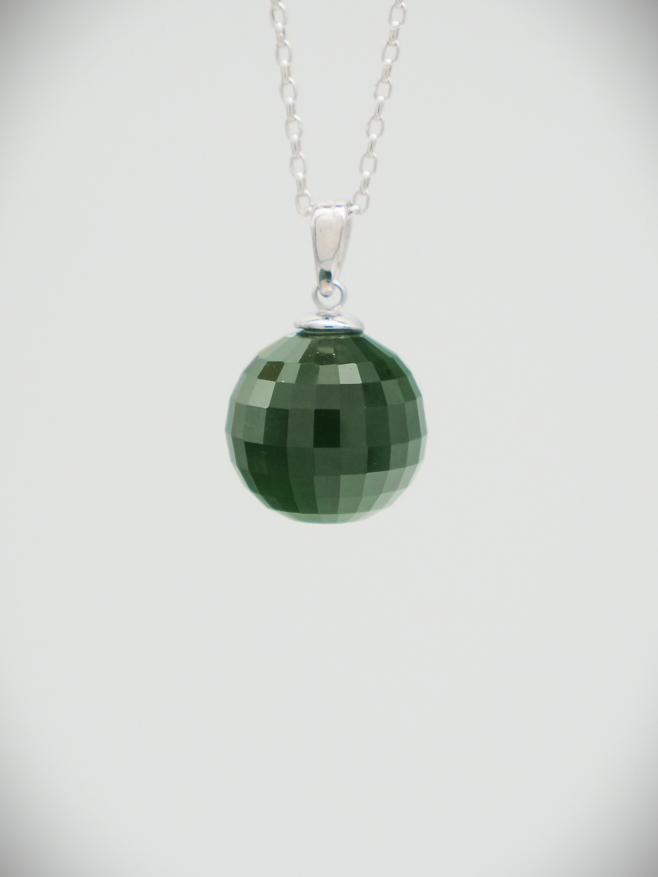 Moko Pounamu Faceted ball Kawakawa Greenstone and Sterling Silver