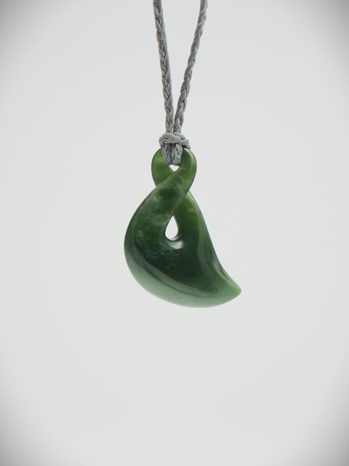 Moko Pounamu Single Pikorua (Twist) NZ Genuine Kawakawa Flower Greenstone - Matarangi