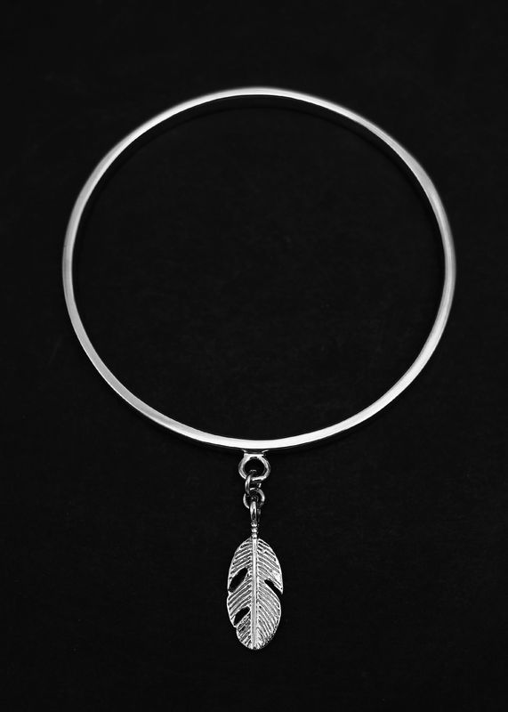 Moko Pounamu Sterling Silver Bangle with Feather Charm Moko Pounamu Sterling Silver Bangle with Feather Charm