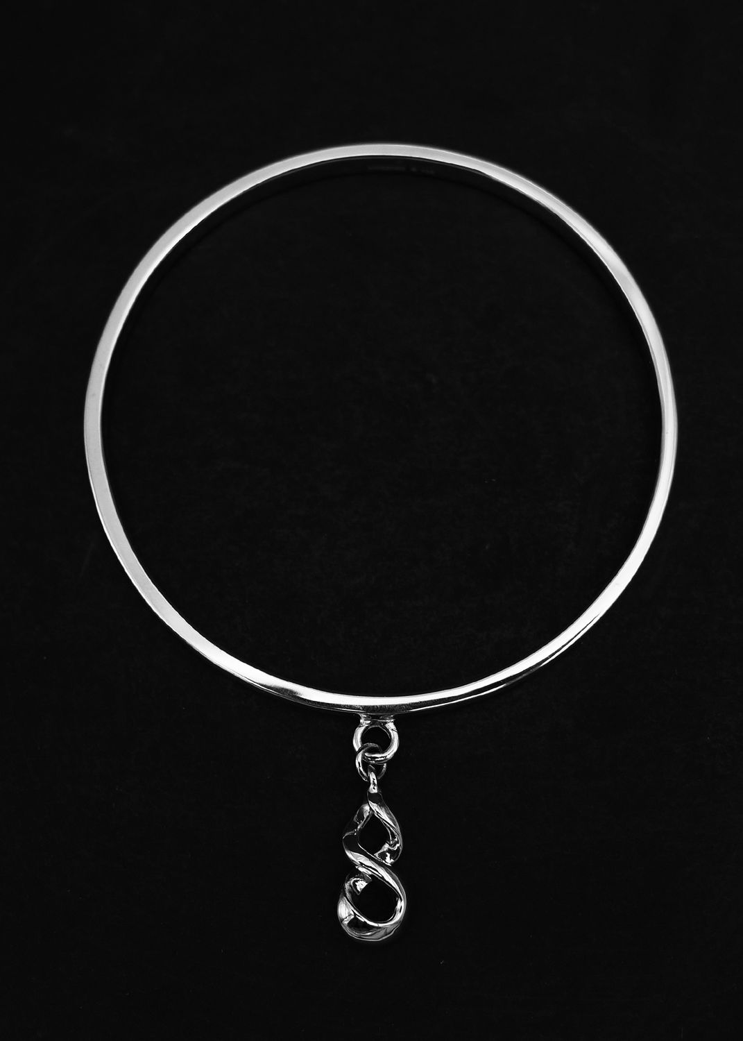 Sterling silver bangle with pikorua charm from Moko Pounamu