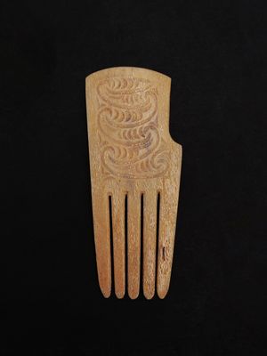 Moko Pounamu Heru Genuine Whale Bone Carving - Aranga Moko Pounamu Heru Genuine Whale Bone Carving - Aranga