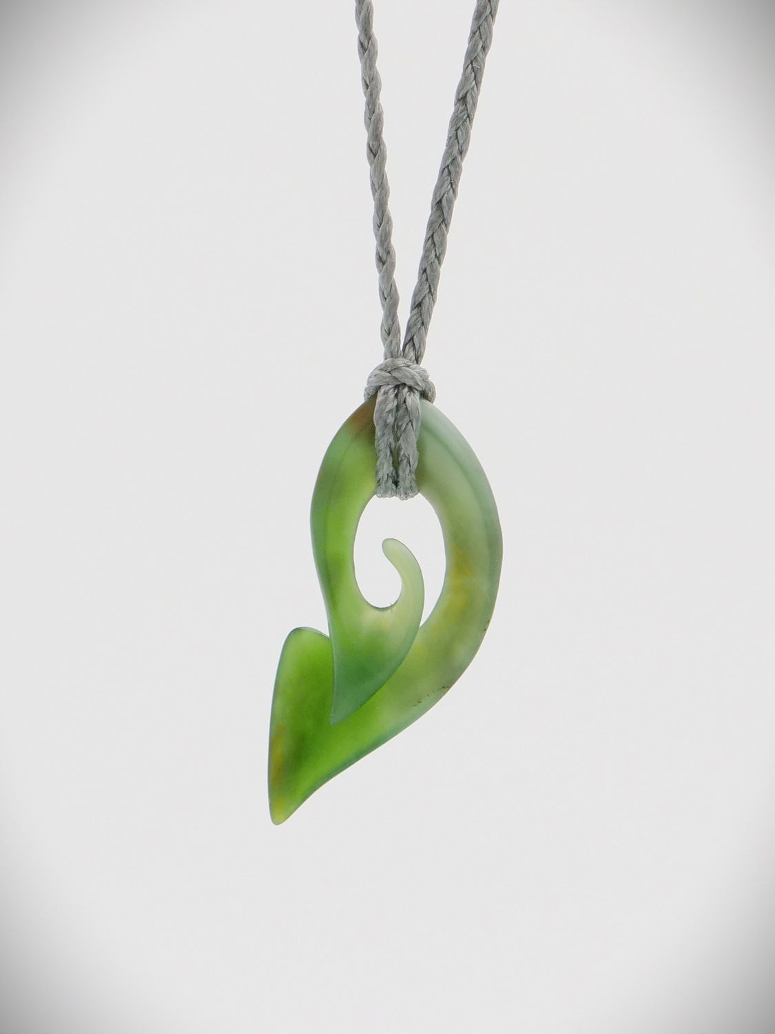 Moko Pounamu Contemporary Koru NZ Genuine Kahurangi Greenstone - Taupaki