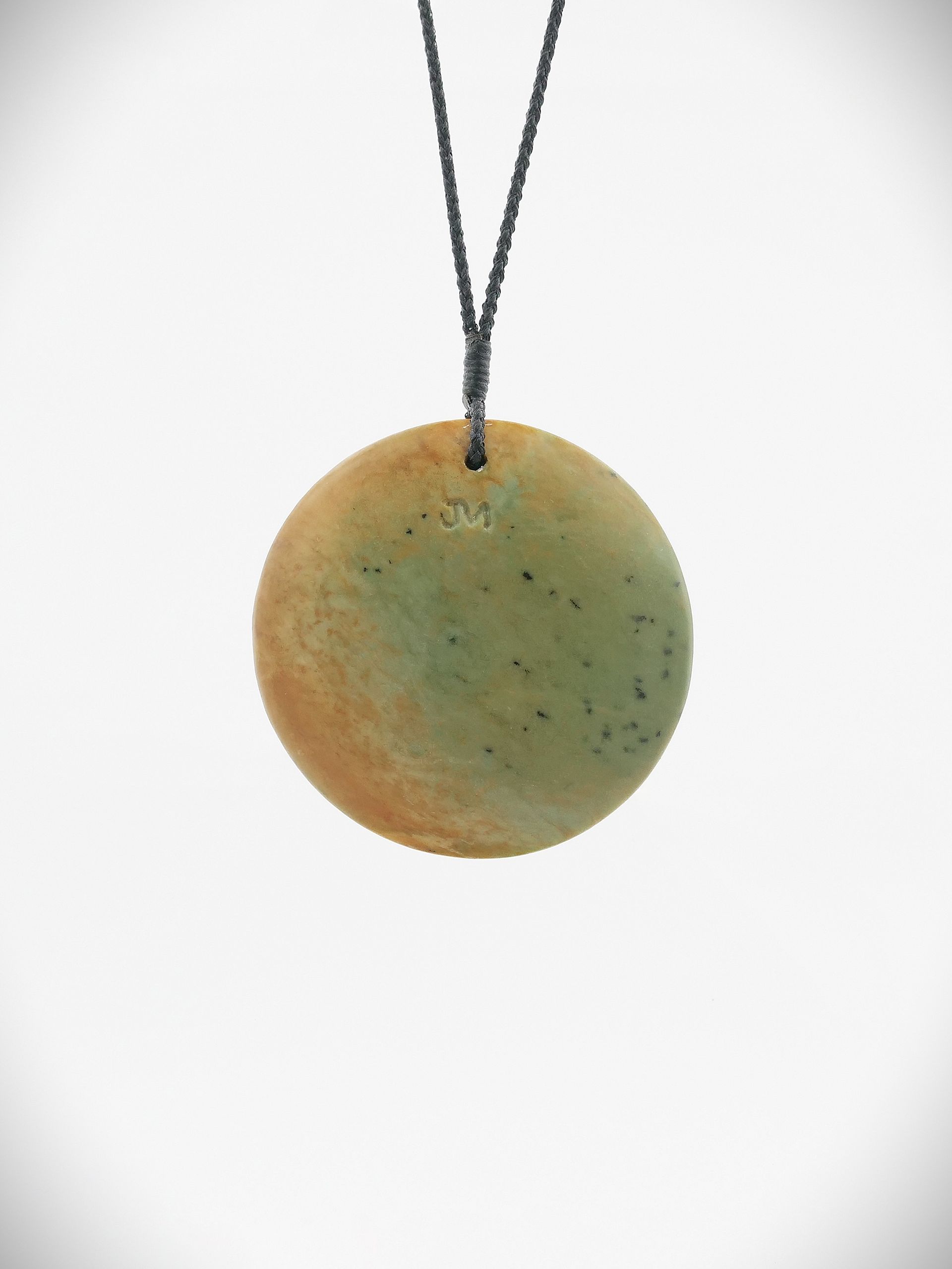 Closed double koru pendant made from NZ Greenstone