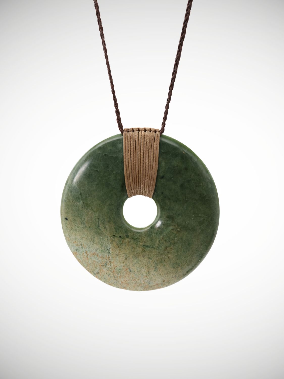 Moko Pounamu Porohita (Disc) Genuine NZ Raukaraka Greenstone - Aratoro Moko Pounamu Porohita (Disc) Genuine NZ Raukaraka Greenstone - Aratoro