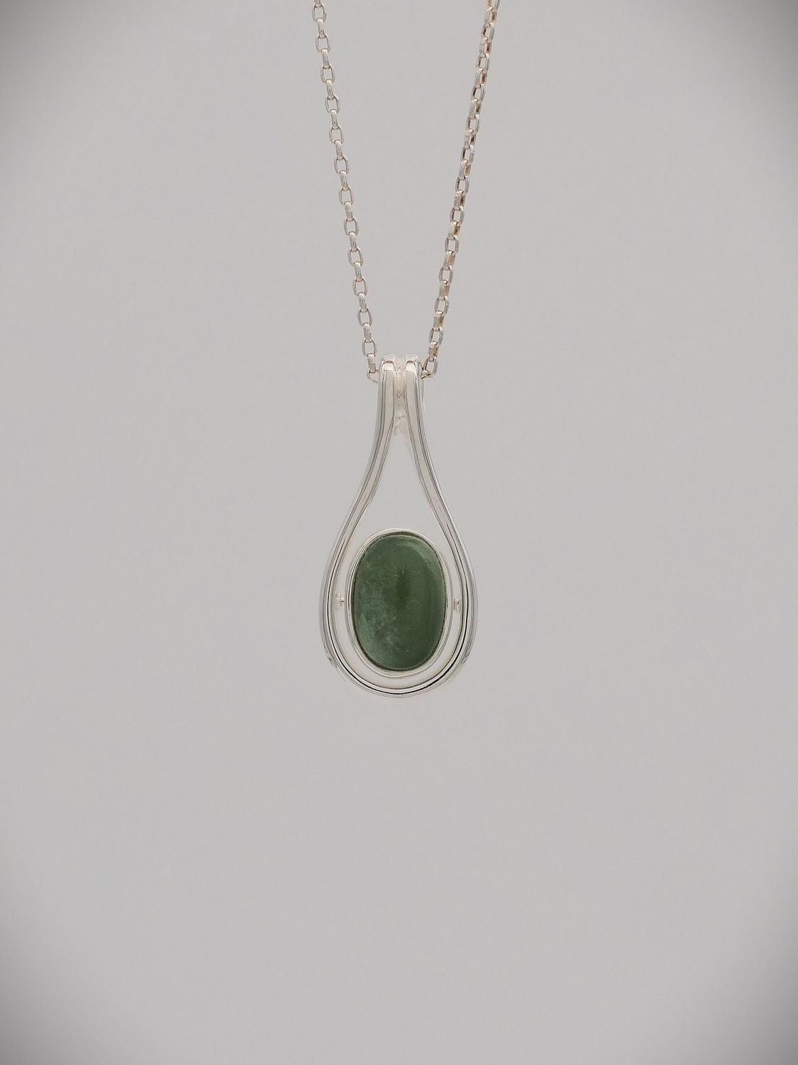 Moko Pounamu Greenstone/Paua and Silver Oval Drop spinning Pendant - 91JP