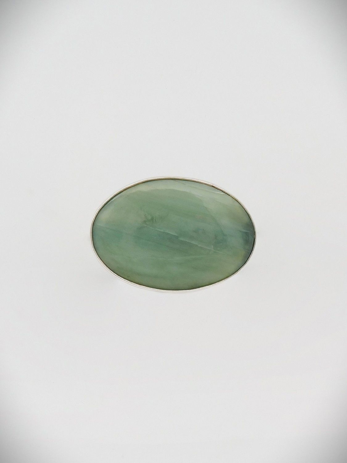 Moko Pounamu Oval Brooch Pīpīwharauroa Inanga Greenstone and Sterling Silver - Hamurana