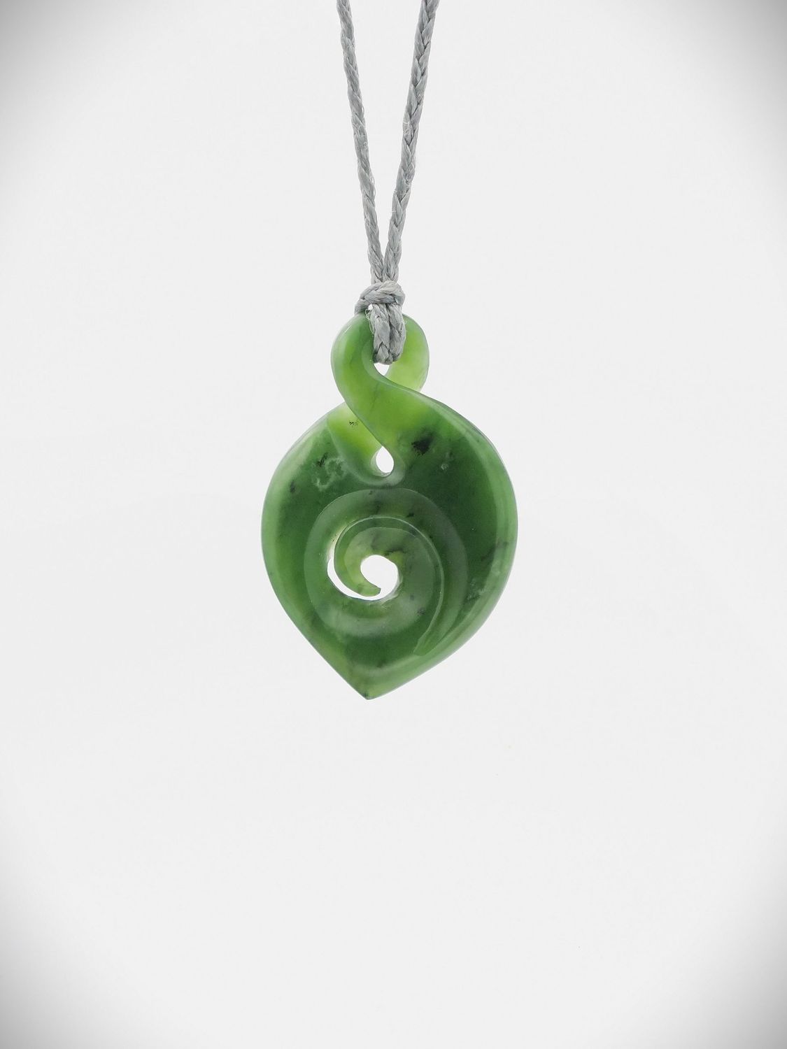 Moko Pounamu Pikorua (Twist) with Koru Genuine NZ Kawakawa Greenstone - Weraiti Moko Pounamu Pikorua (Twist) with Koru Genuine NZ Kawakawa Greenstone - Weraiti